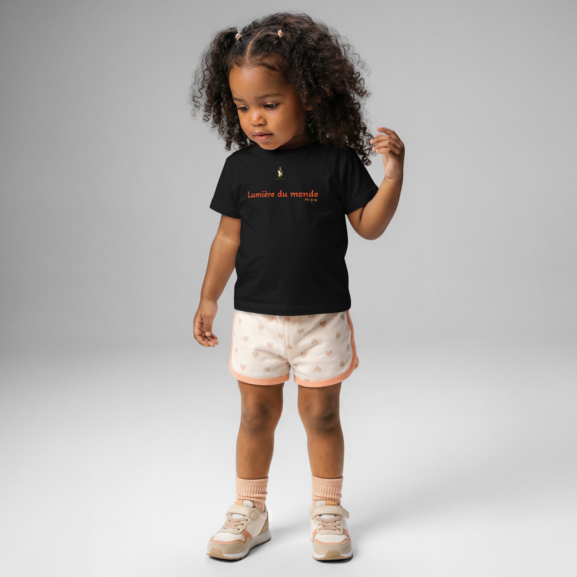 T-shirt bébé KHAWNAN noir, parole « Lumière du monde », vue de face.